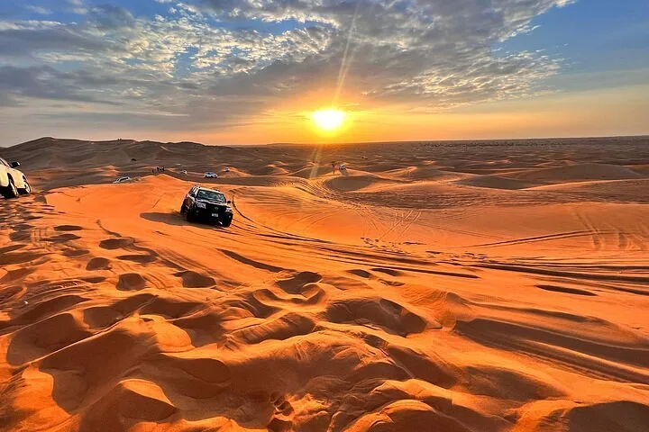 Desert safari dune bashing at sunset